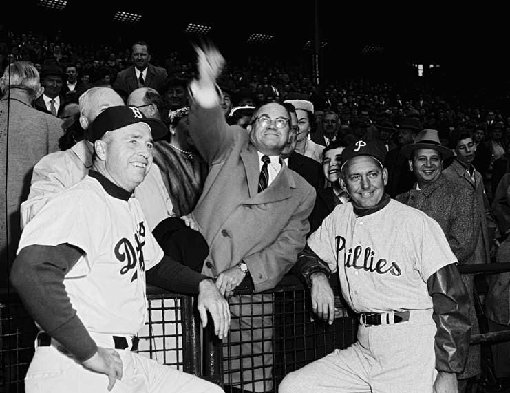 throws out the first pitch at the Dodgers–Phillies game, April 19, 1956, the first of fifteen games—fourteen regular-season, one exhibition—that the Dodgers would play at Roosevelt Stadium during the 1956 and 1957 seasons.