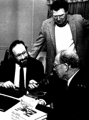 Lawrence Ritter, standing, looks on as Lee Lowenfish, left, interviews Red Barber at Polk Award ceremonies, Long Island University, circa 1985. A shy man, Ritter summoned the courage to call retired players and discovered that most of them were eager to tell their stories.
