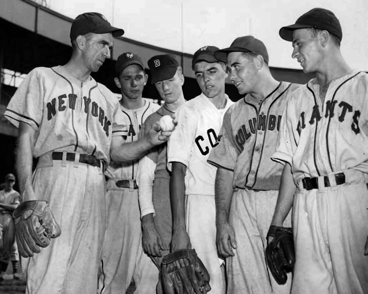 A high school student and pitcher for the Babe Ruth Eastern team, Simmons (third from left) is shown with teammates and Carl Hubbell (left) at the American Legion all-star game at the Polo Grounds in 1945.