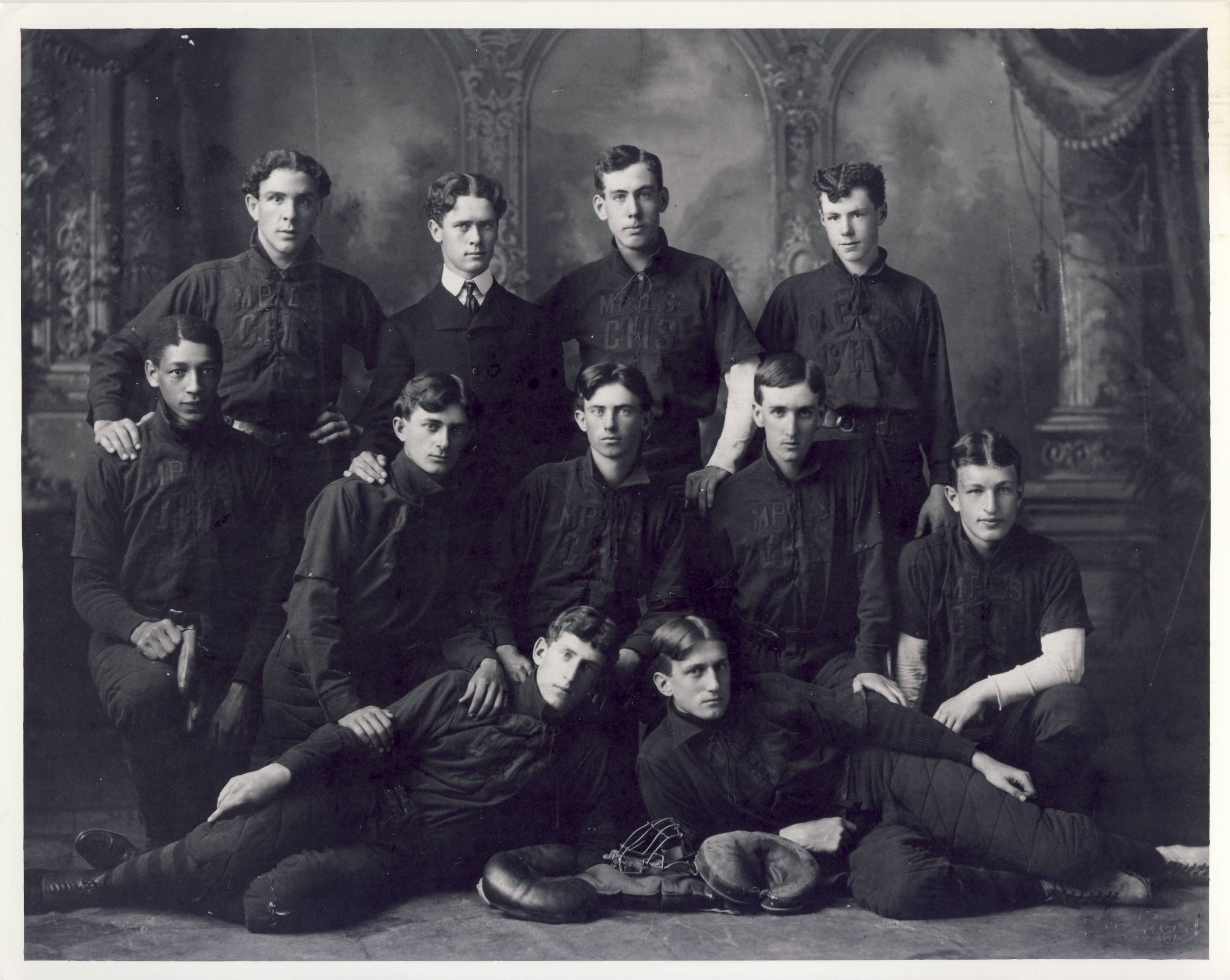 Marshall (second row, left) integrated the 1900 Minneapolis Central High School baseball team, above and broke the color line at the University of Minnesota.