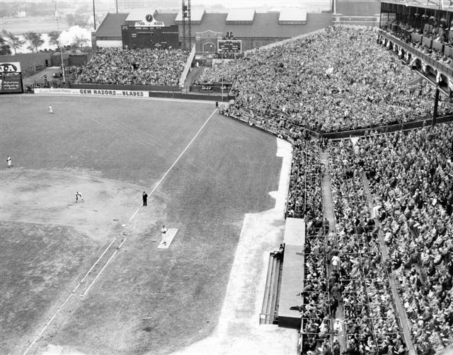 The section of the stands in front of the right field scoreboard is shown at capacity. The name stuck after one wag counted 12 fans in a section of stands built to accommodate 2,000.