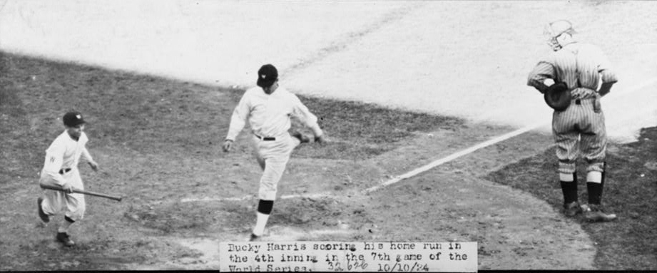 Bucky Harris crossing home plate after his home run in the fourth inning of Game 7.