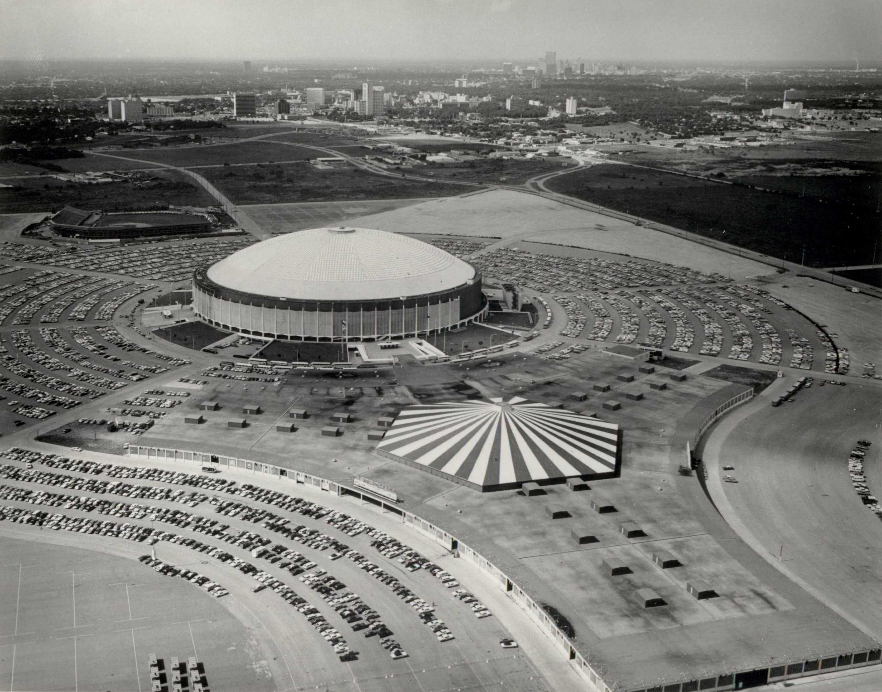 Before the Astrodome was built in 1965, the Houston team played at Colt Stadium, seen in the background.